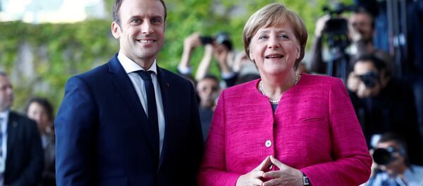 German Chancellor Angela Merkel and French President Emmanuel Macron arrive at a ceremony at the Chancellery in Berlin, Germany, May 15, 2017. German Chancellor Angela Merkel and French President Emmanuel Macron arrive at a ceremony at the Chancellery in Berlin, Germany, May 15, 2017. - Sputnik International