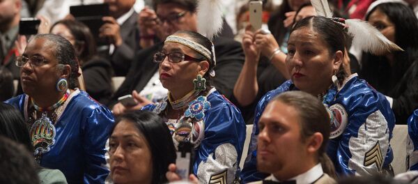 People listen as US President Barack Obama speaks during a panel discussion during the 2015 White House Tribal Nations Conference at the Ronald Reagan Building and International Trade Center in Washington, DC, November 5, 2015. - Sputnik International