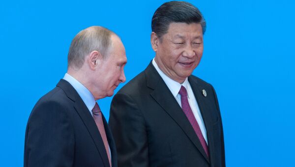 May 15, 2017. Russian President Vladimir Putin and Chinese President Xi Jinping, right, during the welcome ceremony for the heads of the delegations participating in the Belt and Road Forum, at the Yanqi Lake International Convention Center. - Sputnik International