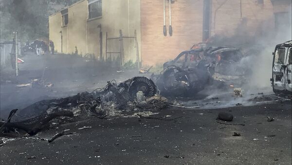 In this image provided by the Town of Carlstadt smoke rises after a jet crashed into a building near Teterboro Airport in Carlstadt, N.J., Monday, May 15, 2017. - Sputnik International