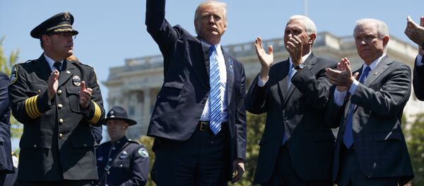 President Donald Trump pumps his fist. President Donald Trump pumps his fist. - Sputnik International