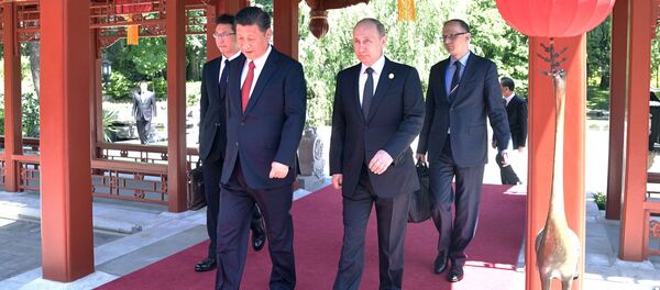 May 14, 2017. President Vladimir Putin and President of China Xi Jinping, right, during a walk after the Russia-China talks at the One Belt, One Road international forum. May 14, 2017. President Vladimir Putin and President of China Xi Jinping, right, during a walk after the Russia-China talks at the One Belt, One Road international forum. - Sputnik International