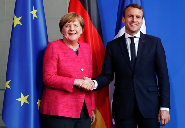 German Chancellor Angela Merkel and French President Emmanuel Macron shake hands after a news conference at the Chancellery in Berlin, Germany, May 15, 2017. German Chancellor Angela Merkel and French President Emmanuel Macron shake hands after a news conference at the Chancellery in Berlin, Germany, May 15, 2017. - Sputnik International