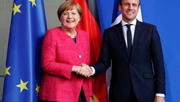 German Chancellor Angela Merkel and French President Emmanuel Macron shake hands after a news conference at the Chancellery in Berlin, Germany, May 15, 2017. - Sputnik International