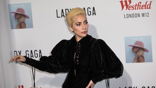Singer Lady Gaga poses for photographers during a photo call before her surprise acoustic performance in London, Thursday, Dec. 1, 2016. - Sputnik International