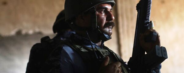 A member of Iraqi Federal Police stands guard at a factory used by Islamic State militants to manufacture home made mortars in western Mosul, Iraq, May 11, 2017. A member of Iraqi Federal Police stands guard at a factory used by Islamic State militants to manufacture home made mortars in western Mosul, Iraq, May 11, 2017. - Sputnik International