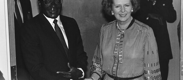 Prime Minister Margaret Thatcher of Great Britain meets with President Robert Mugabe of Zimbabwe in Nassau, Friday, Oct. 18, 1985 before the morning session of the Commonwealth Heads of Government Meeting. Prime Minister Margaret Thatcher of Great Britain meets with President Robert Mugabe of Zimbabwe in Nassau, Friday, Oct. 18, 1985 before the morning session of the Commonwealth Heads of Government Meeting. - Sputnik International