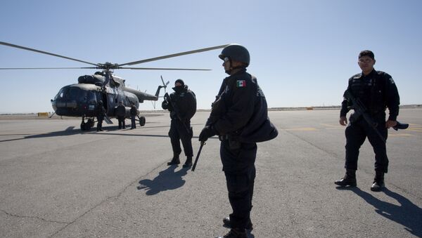 A Russian-made Mi-8 police helicopter stands by on the tarmac prior to take off on a patrol mission over Ciudad Juarez, Mexico - Sputnik International