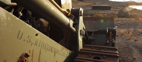 An abandoned US Air Force vehicle is seen on Aug. 16, 2005, outside the eastern Greenland settlement of Kulusuk where there used to be a U.S. Air Force base as part of an early warning radar system. - Sputnik International
