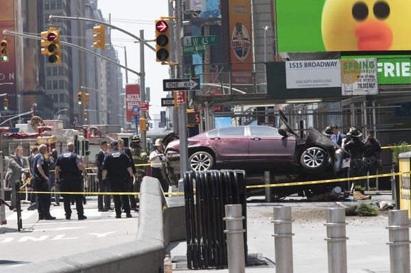 A car rests on a security barrier in New York's Times Square after driving through a crowd of pedestrians, injuring at least a dozen people, Thursday, May 18, 2017. A car rests on a security barrier in New York's Times Square after driving through a crowd of pedestrians, injuring at least a dozen people, Thursday, May 18, 2017. - Sputnik International