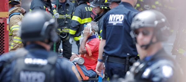 First responders tend to an injured pedestrian after a vehicle struck pedestrians on a sidewalk in Times Square in New York, U.S., May 18, 2017. First responders tend to an injured pedestrian after a vehicle struck pedestrians on a sidewalk in Times Square in New York, U.S., May 18, 2017. - Sputnik International