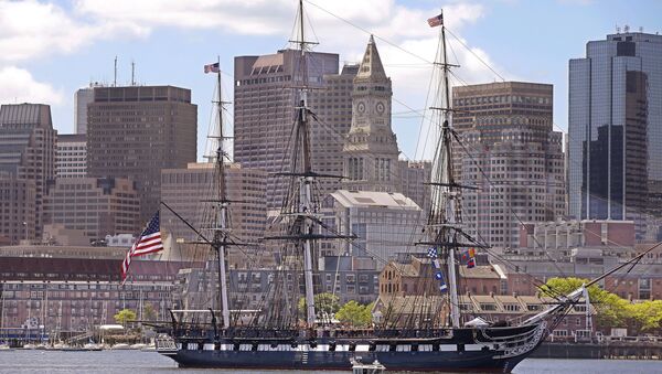 The USS Constitution, or Old Ironsides, the US Navy's oldest commissioned ship is towed through Boston Harbor past the financial district skyline in honor of the 70th Anniversary of D-Day Friday, June 6, 2014 in Boston. - Sputnik International