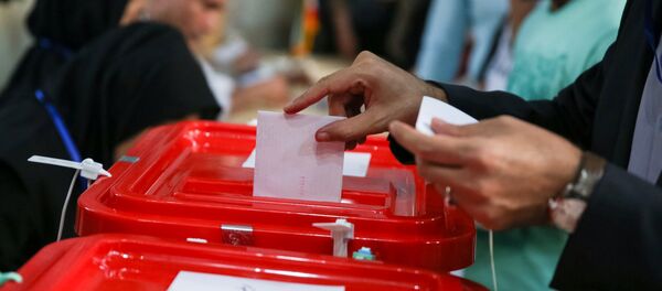 An Iranian man casts his vote into a ballot box during the presidential election in Tehran, Iran, May 19, 2017 An Iranian man casts his vote into a ballot box during the presidential election in Tehran, Iran, May 19, 2017 - Sputnik International