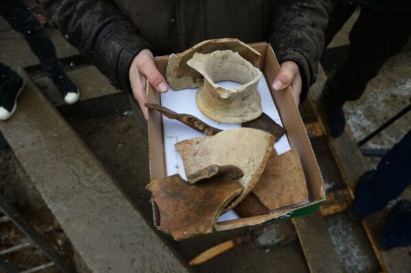 Artifacts unearthed by archeologists during preparatory works for the reconstruction of Moscow's downtown streets Artifacts unearthed by archeologists during preparatory works for the reconstruction of Moscow's downtown streets - Sputnik International