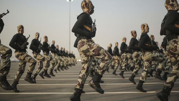 In this Sept. 17, 2015 file photo, Saudi security forces take part in a military parade in preparation for the annual Hajj pilgrimage in Mecca, Saudi Arabia. - Sputnik International