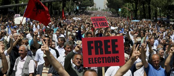 Supporters of Albania's main opposition take part in a protest demanding a caretaker cabinet to take the country to the June 18 parliamentary election, on Saturday, May 13, 2017 Supporters of Albania's main opposition take part in a protest demanding a caretaker cabinet to take the country to the June 18 parliamentary election, on Saturday, May 13, 2017 - Sputnik International