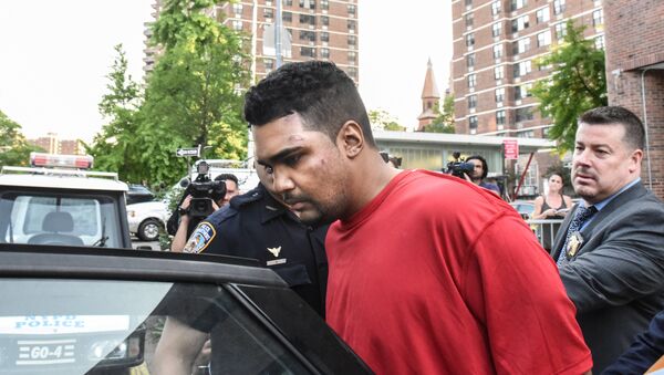 Richard Rojas is escorted from the 7th precinct by New York City Police officers after being processed in connection with the speeding vehicle that struck pedestrians on a sidewalk in Times Square in New York City, U.S. May 18, 2017 - Sputnik International