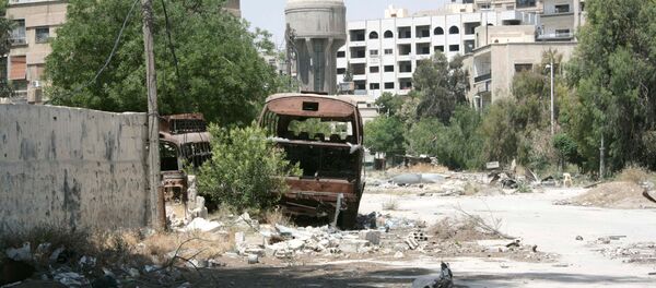 A view shows damaged buildings in Qaboun neighbourhood of Damascus, in this handout picture provided by SANA on May 16, 2017 - Sputnik International