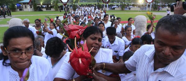 Family members of fallen Sri Lankan government soldiers arrive to pay homage to the war memorial during the national war heroes memorial ceremony in Colombo, Sri Lanka, Friday, May 19, 2017. Family members of fallen Sri Lankan government soldiers arrive to pay homage to the war memorial during the national war heroes memorial ceremony in Colombo, Sri Lanka, Friday, May 19, 2017. - Sputnik International