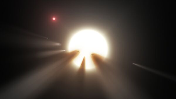 This illustration shows a star behind a shattered comet. Observations of the star KIC 8462852 by NASA's Kepler and Spitzer space telescopes suggest that its unusual light signals are likely from dusty comet fragments, which blocked the light of the star as they passed in front of it in 2011 and 2013 - Sputnik International
