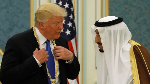 Saudi Arabia's King Salman bin Abdulaziz Al Saud (R) presents U.S. President Donald Trump with the Collar of Abdulaziz Al Saud Medal at the Royal Court in Riyadh, Saudi Arabia May 20, 2017 - Sputnik International
