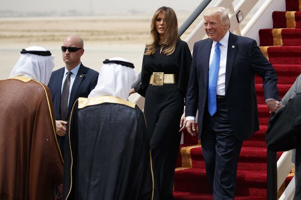 U.S. President Donald Trump, accompanied by first lady Melania Trump, smiles at Saudi King Salman, left, upon his arrival at a welcome ceremony at the Royal Terminal of King Khalid International Airport, Saturday, May 20, 2017, in Riyadh. - Sputnik International
