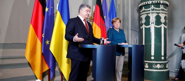 German Chancellor Angela Merkel and Ukrainian President Petro Poroshenko adress the media after a meeting at the German government guesthouse Meseberg Palace in Meseberg, Germany, May 20, 2017 German Chancellor Angela Merkel and Ukrainian President Petro Poroshenko adress the media after a meeting at the German government guesthouse Meseberg Palace in Meseberg, Germany, May 20, 2017 - Sputnik International