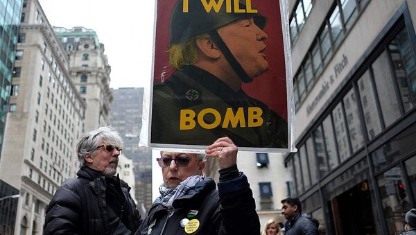 Anti-war protesters shout slogans against US President Donald Trump during a demonstration in front of the Trump Tower in New York on April 7, 2017, to protest the US air strike in Syria - Sputnik International