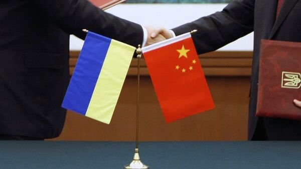Flags of Ukraine and China - Sputnik International