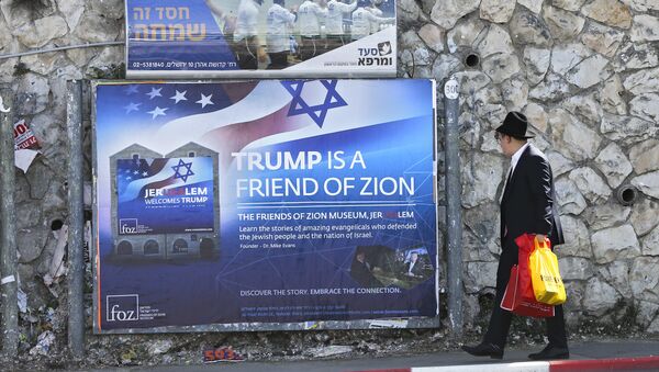 An Ultra-Orthodox Jewish man passes by a billboard welcoming President Donald Trump ahed of his visit, in Jerusalem, Friday, May 19, 2017 - Sputnik International