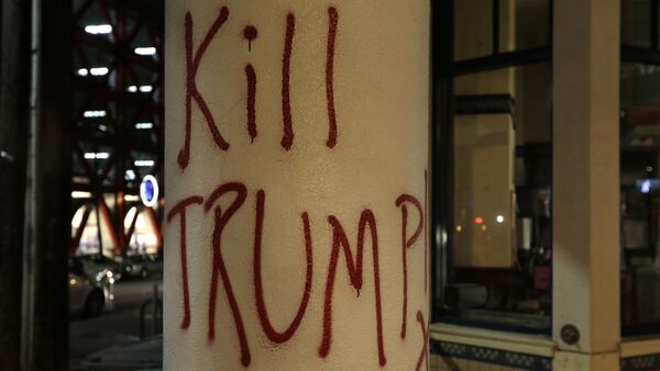 Graffiti left by protesters who were against a scheduled speaking appearance by Breitbart News editor Milo Yiannopoulos is seen Wednesday, Feb. 1, 2017, in Berkeley, Calif - Sputnik International