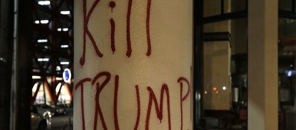 Graffiti left by protesters who were against a scheduled speaking appearance by Breitbart News editor Milo Yiannopoulos is seen Wednesday, Feb. 1, 2017, in Berkeley, Calif - Sputnik International