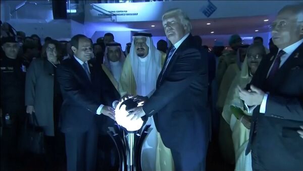 U.S. President Donald Trump places his hands on a glowing orb as he tours with other leaders the Global Center for Combatting Extremist Ideology in Riyadh, Saudi Arabia May 21, 2017 - Sputnik International