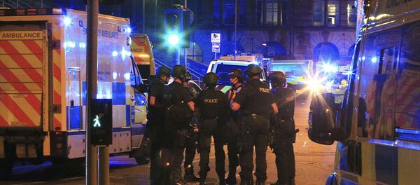 Armed police gather at Manchester Arena after reports of an explosion at the venue during an Ariana Grande gig in Manchester, England Monday, May 22, 2017. - Sputnik International
