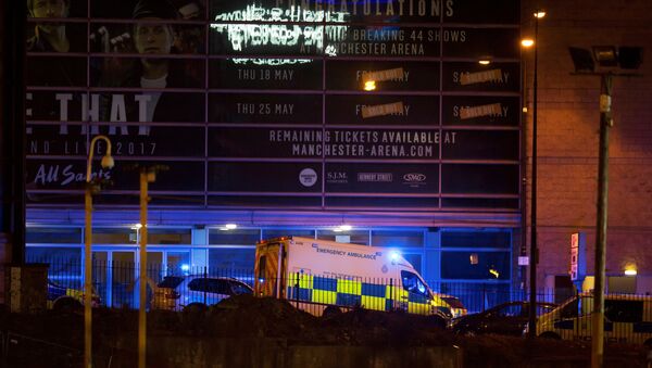 A police van and an ambulance are seen outside the Manchester Arena, where U.S. singer Ariana Grande had been performing, in Manchester - Sputnik International