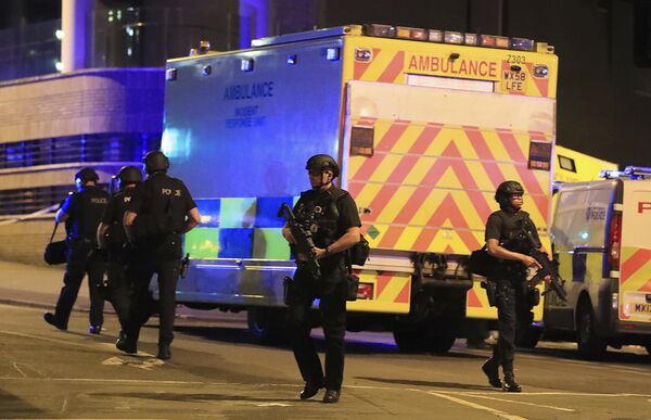 Police stand near an ambulance at Manchester Arena after reports of an explosion at the venue during an Ariana Grande concert on Monday, May 22, 2017. Police stand near an ambulance at Manchester Arena after reports of an explosion at the venue during an Ariana Grande concert on Monday, May 22, 2017. - Sputnik International