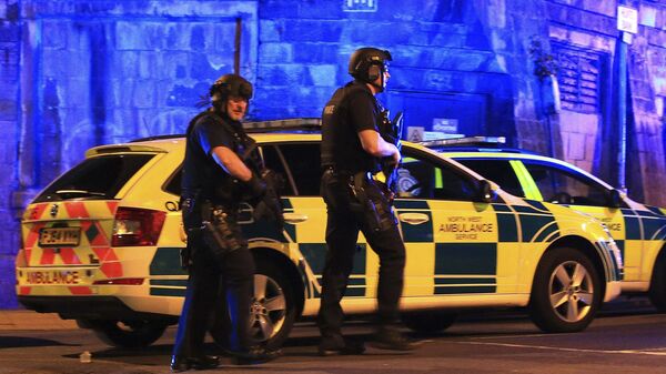 Armed police work at Manchester Arena after reports of an explosion at the venue during an Ariana Grande gig in Manchester, England Monday, May 22, 2017. - Sputnik International