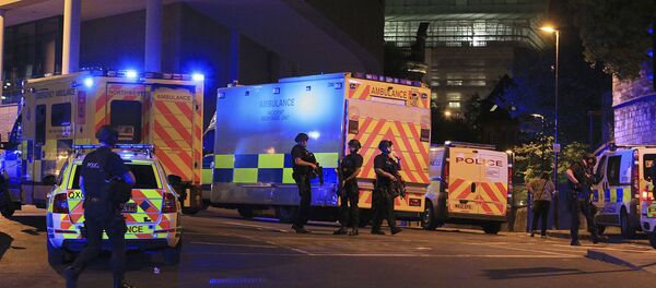 Armed police positioned near emergency vehicles after reports of an explosion at the Manchester Arena during an Ariana Grande concert in Manchester, England Monday, May 22, 2017. Armed police positioned near emergency vehicles after reports of an explosion at the Manchester Arena during an Ariana Grande concert in Manchester, England Monday, May 22, 2017. - Sputnik International
