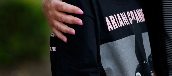 A youngster wearing a t-shirt showing U.S. singer Ariana Grande talks to the media near the Manchester Arena in Manchester, Britain May 23, 2017. A youngster wearing a t-shirt showing U.S. singer Ariana Grande talks to the media near the Manchester Arena in Manchester, Britain May 23, 2017. - Sputnik International