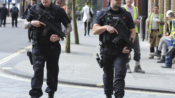 Armed police patrol the streets near to Manchester Arena in central Manchester, England, Tuesday May 23, 2017. - Sputnik International