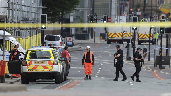 Police guard close to the Manchester Arena in Manchester, Britain a day after an explosion - Sputnik International
