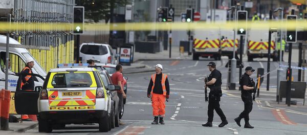 Police guard close to the Manchester Arena in Manchester, Britain a day after an explosion - Sputnik International