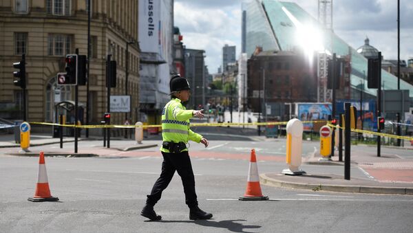 A police officer potrols a cordon near to the Manchester Arena in Manchester, northwest England on May 23, 2017 - Sputnik International