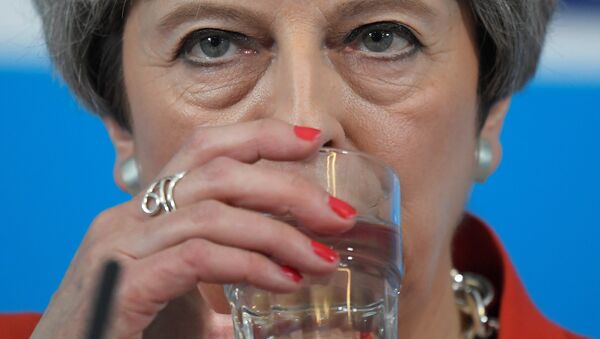 Britain's Prime Minister Theresa May sips water as she speaks at an election campaign event in Wrexham, Wales May 22, 2017. - Sputnik International