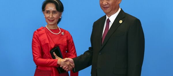 Chinese President Xi Jinping, right, shakes hands with Myanmar's State Counselor Aung San Suu Kyi as they attend the welcome ceremony at Yanqi Lake during the Belt and Road Forum, in Beijing, Monday, May 15, 2017. Chinese President Xi Jinping, right, shakes hands with Myanmar's State Counselor Aung San Suu Kyi as they attend the welcome ceremony at Yanqi Lake during the Belt and Road Forum, in Beijing, Monday, May 15, 2017. - Sputnik International