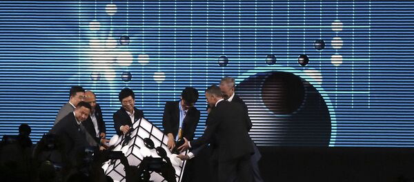 Go player Ke Jie of China, third from right, and other participants place pieces on a checkered cube during the opening ceremony of the Future of Go Summit in Wuzhen in eastern China's Zhejiang Province, Tuesday, May 23, 2017. Go player Ke Jie of China, third from right, and other participants place pieces on a checkered cube during the opening ceremony of the Future of Go Summit in Wuzhen in eastern China's Zhejiang Province, Tuesday, May 23, 2017. - Sputnik International