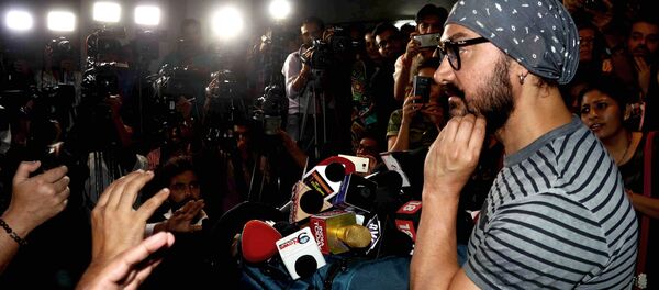 Indian Bollywood actor Aamir Khan interacts with the media during the promotion of the upcoming biographical sports drama Hindi film Dangal in Mumbai on November 28, 2016. Indian Bollywood actor Aamir Khan interacts with the media during the promotion of the upcoming biographical sports drama Hindi film Dangal in Mumbai on November 28, 2016. - Sputnik International