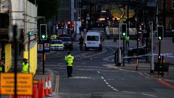 Police patrol the secure area outside the Manchester Arena in central Manchester, Britain May 23, 2017. - Sputnik International