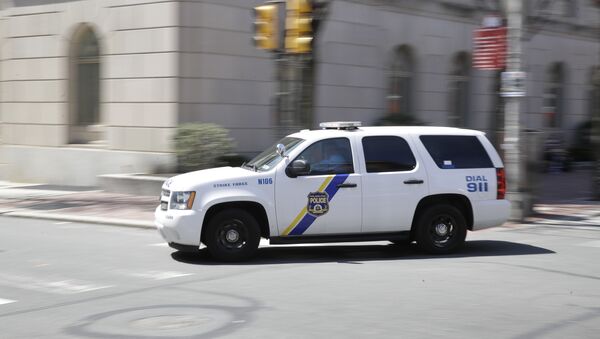 A police department vehicle drives to a call - Sputnik International