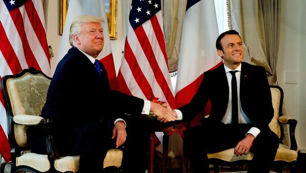 U.S. President Donald Trump (L) shakes hands with French President Emmanuel Macron before a working lunch ahead of a NATO Summit in Brussels, Belgium, May 25, 2017. - Sputnik International